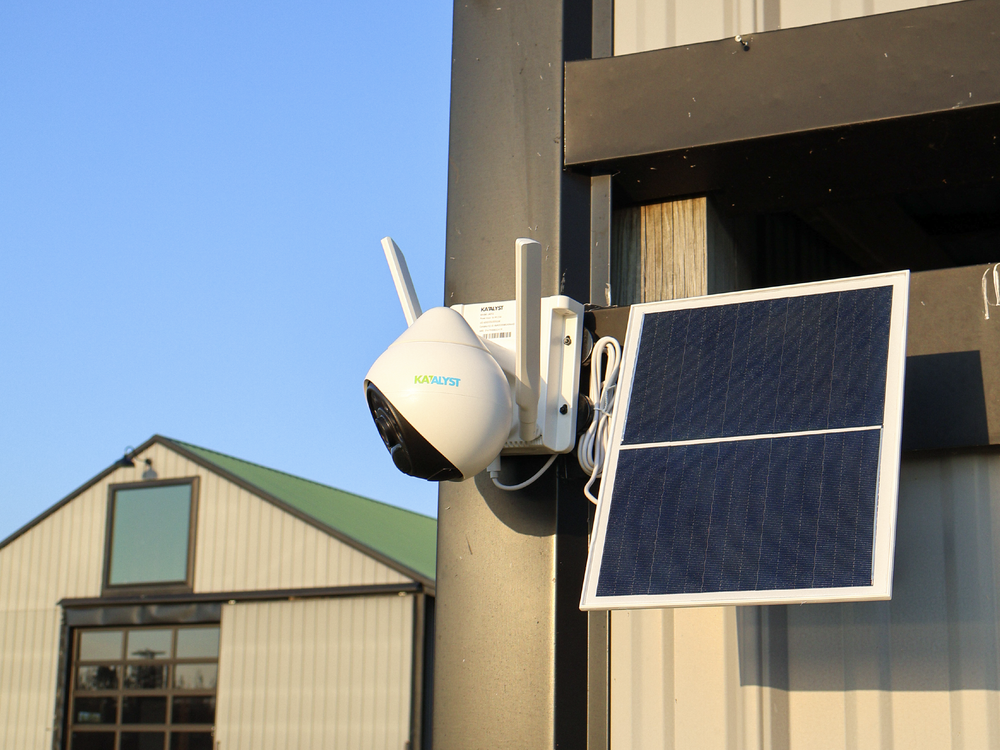 Hawk LTE camera and solar panel mounted outside a building